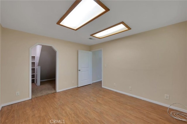 empty room with light hardwood / wood-style floors