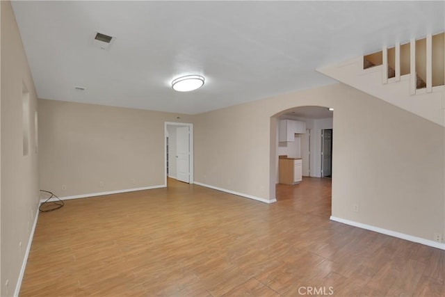 spare room featuring light hardwood / wood-style floors