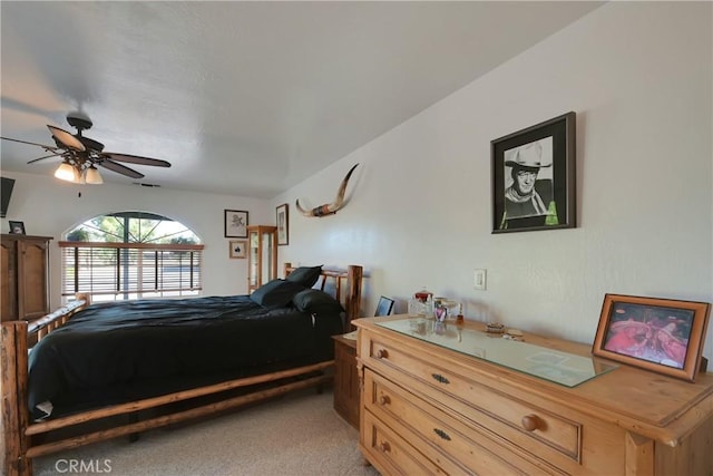 bedroom featuring light carpet and ceiling fan