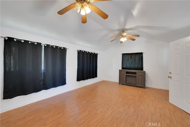 interior space with vaulted ceiling, ceiling fan, and light hardwood / wood-style floors