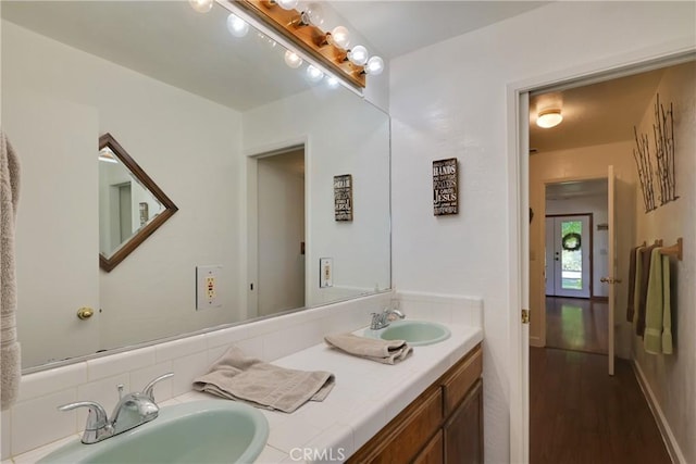 bathroom with vanity and wood-type flooring