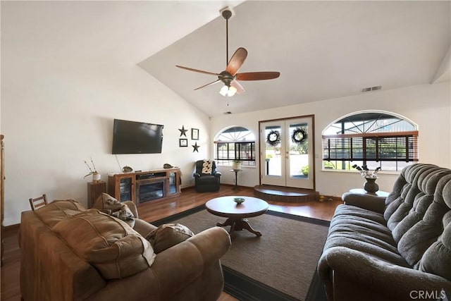 living room with hardwood / wood-style flooring, a wealth of natural light, and french doors