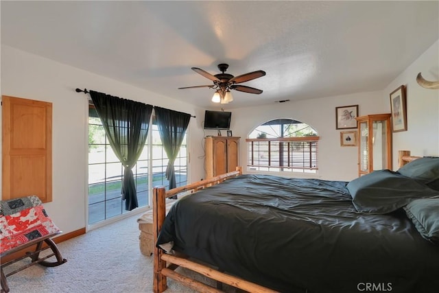 bedroom with ceiling fan, light colored carpet, and access to exterior