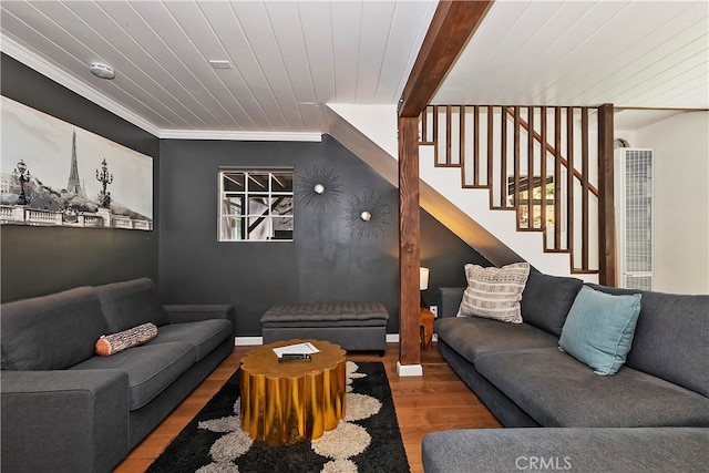 living room featuring hardwood / wood-style floors, ornamental molding, beamed ceiling, and wood ceiling