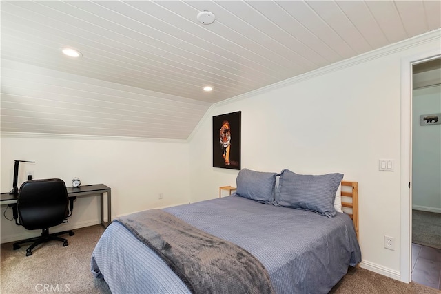 carpeted bedroom featuring crown molding, wood ceiling, and lofted ceiling