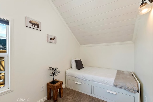 bedroom featuring carpet floors and vaulted ceiling