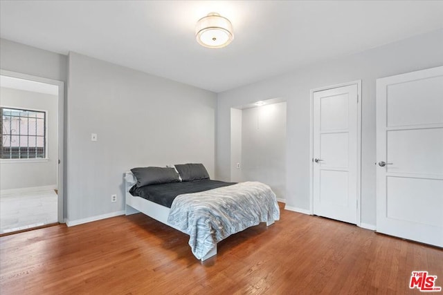 bedroom featuring hardwood / wood-style flooring