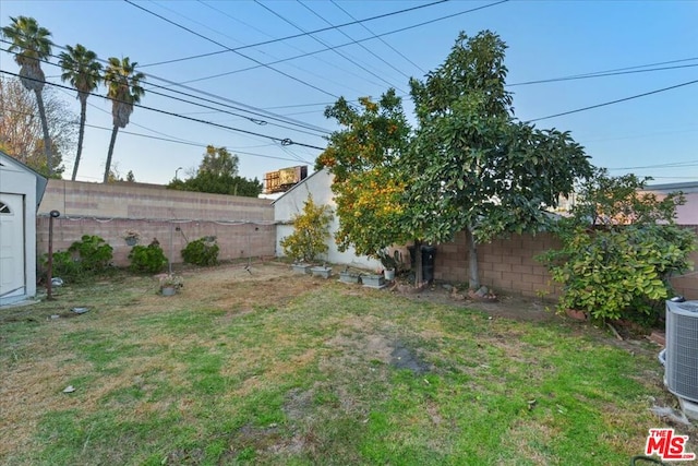 view of yard with central air condition unit