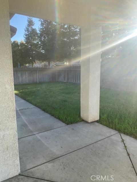 view of yard with fence and a patio area