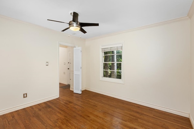 empty room with crown molding, hardwood / wood-style floors, and ceiling fan