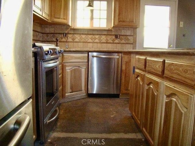 kitchen featuring a healthy amount of sunlight, backsplash, and appliances with stainless steel finishes