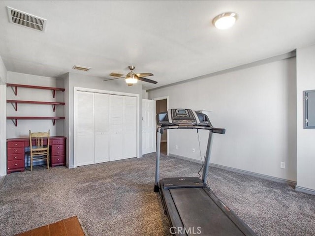 exercise area featuring carpet and ceiling fan