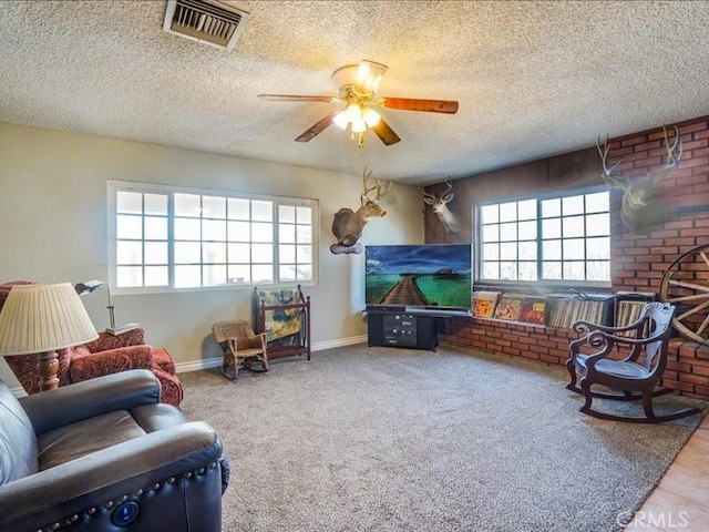 interior space with ceiling fan and a textured ceiling