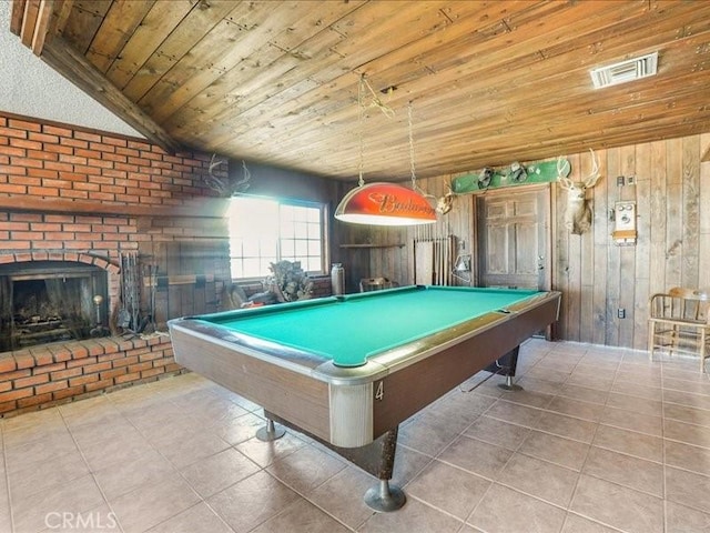 playroom with wood ceiling, light tile patterned floors, wood walls, a fireplace, and pool table