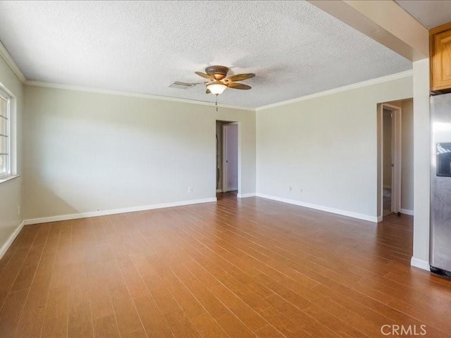 empty room featuring hardwood / wood-style floors, a textured ceiling, and ceiling fan