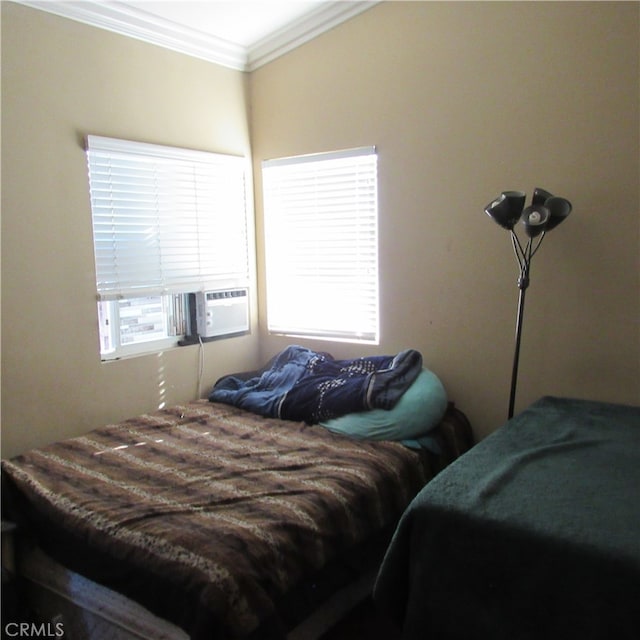 bedroom featuring crown molding