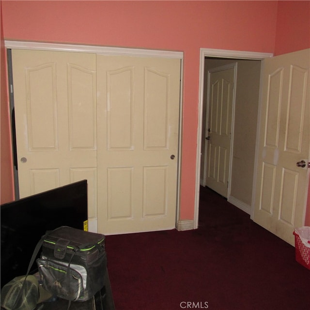 carpeted bedroom featuring a closet