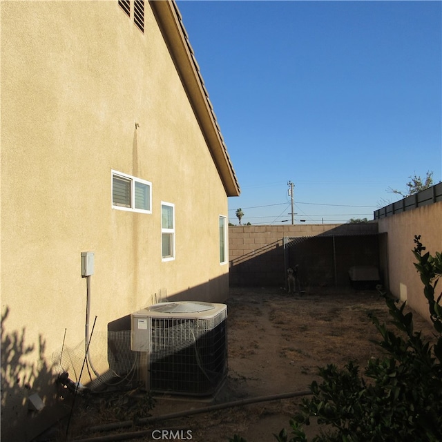 view of side of property featuring cooling unit