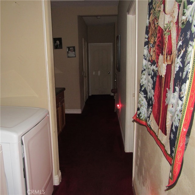 hallway featuring washing machine and clothes dryer