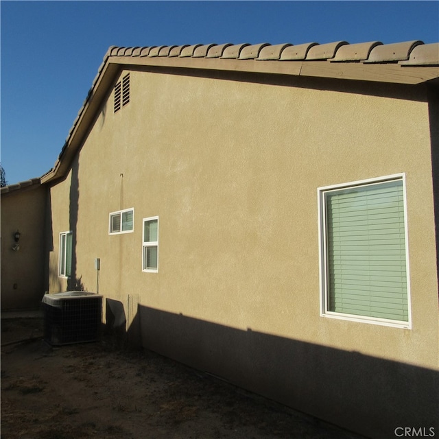 view of home's exterior featuring central AC unit