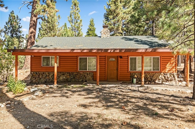 view of log cabin