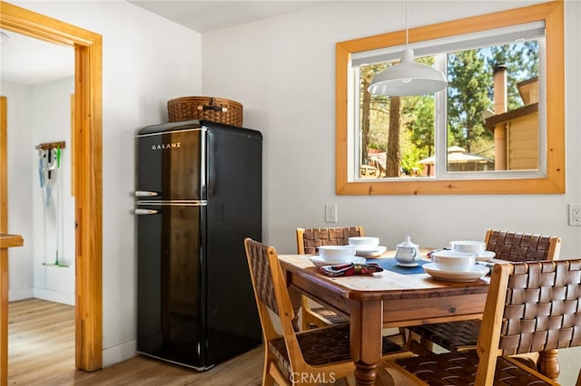 dining space featuring light hardwood / wood-style flooring