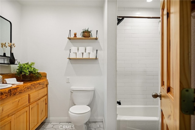 full bathroom with vanity, tiled shower / bath combo, toilet, and tile patterned floors