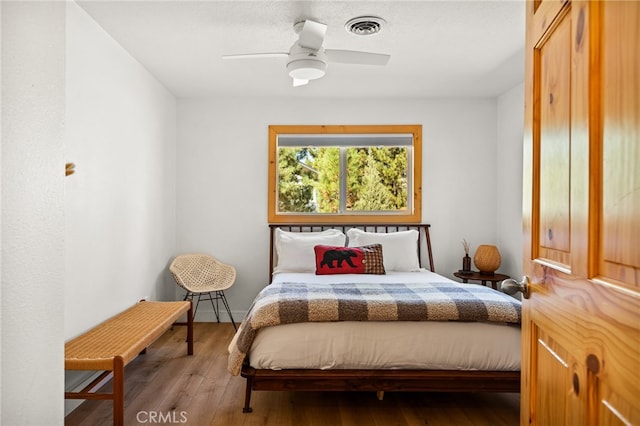 bedroom featuring wood-type flooring and ceiling fan