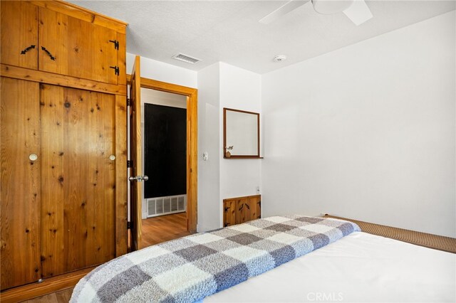 bedroom featuring ceiling fan and hardwood / wood-style floors