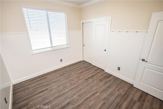 110 Montage Dr, Merced, CA 95348 - unfurnished bedroom featuring wood finished floors, a closet, wainscoting, ornamental molding, and baseboards