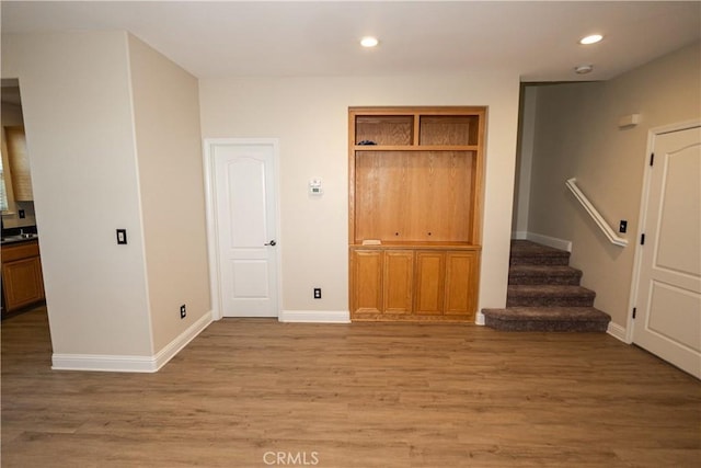 unfurnished bedroom featuring hardwood / wood-style floors