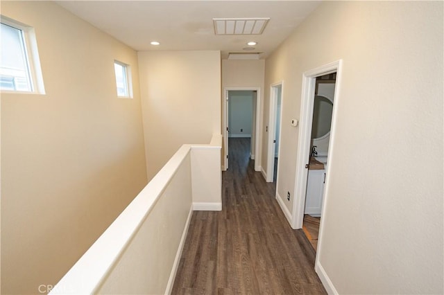 corridor featuring dark wood-type flooring