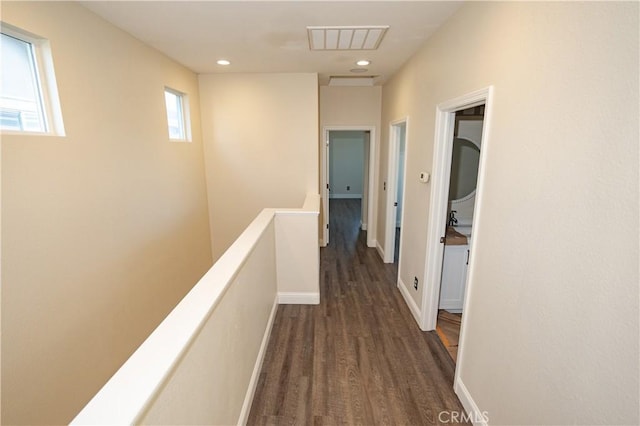110 Montage Dr, Merced, CA 95348 - hall featuring an upstairs landing, dark wood-style floors, recessed lighting, and baseboards