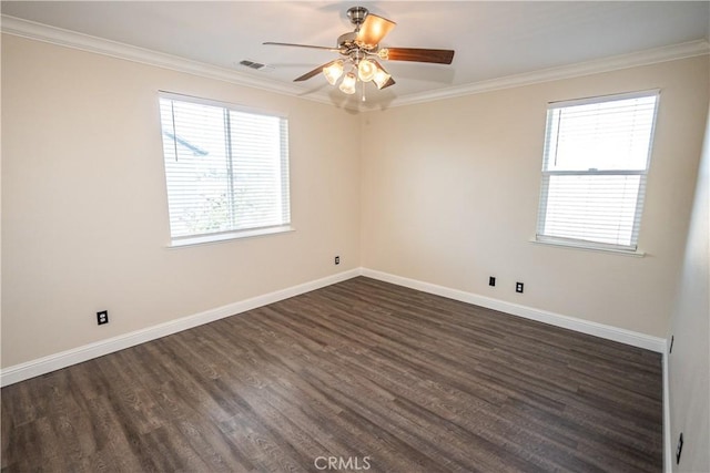 empty room featuring ornamental molding, ceiling fan, and dark wood-type flooring