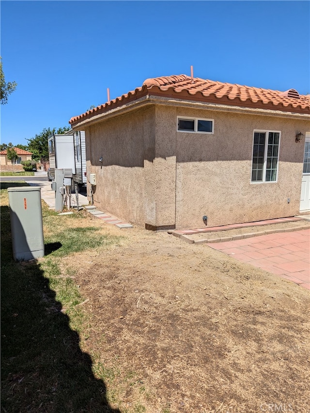 view of home's exterior with a patio