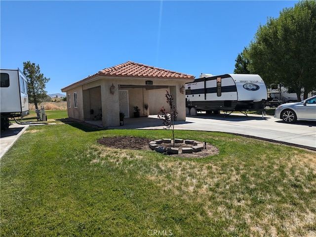 view of yard with a fire pit