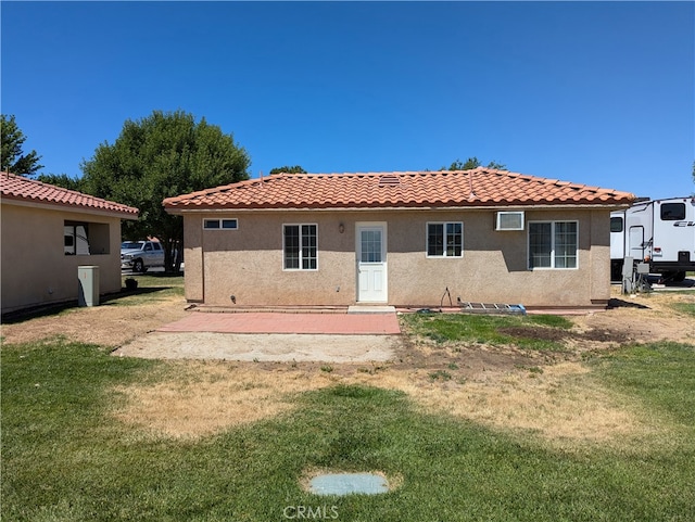 rear view of house with a lawn