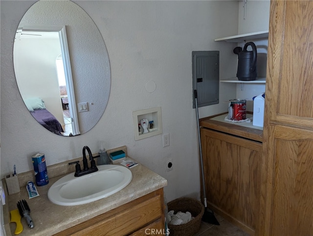 bathroom with vanity, electric panel, and tile patterned floors