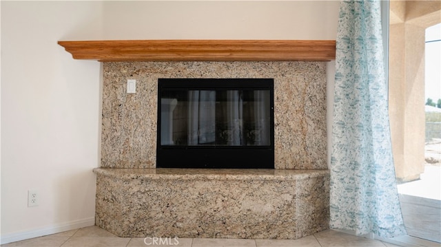 details featuring a premium fireplace