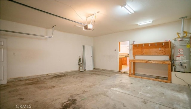 garage with water heater and a garage door opener