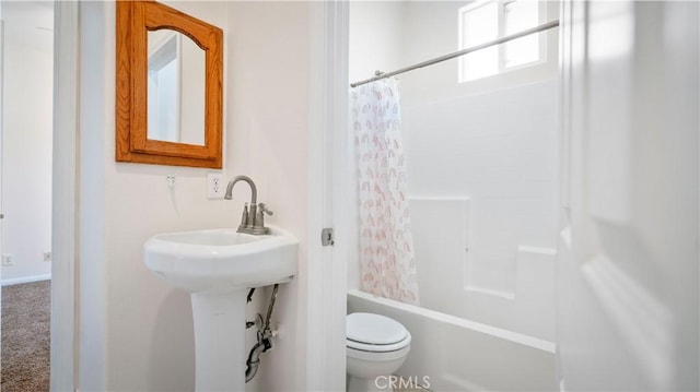 full bath featuring shower / tub combo and toilet