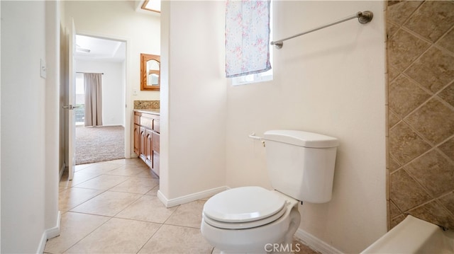 bathroom with tile patterned flooring, vanity, and toilet