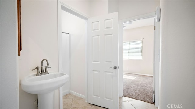 bathroom with sink and tile patterned flooring