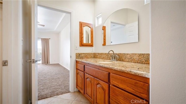 bathroom with tile patterned floors and vanity