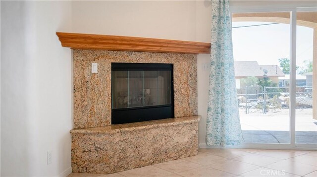 interior details featuring a premium fireplace and baseboards