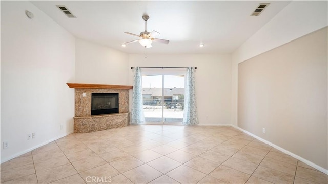 unfurnished living room featuring light tile patterned flooring, visible vents, a ceiling fan, and baseboards