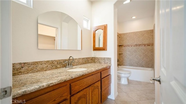 bathroom with toilet, washtub / shower combination, vanity, and tile patterned floors