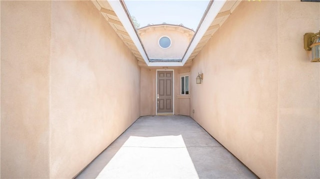 entrance to property with stucco siding