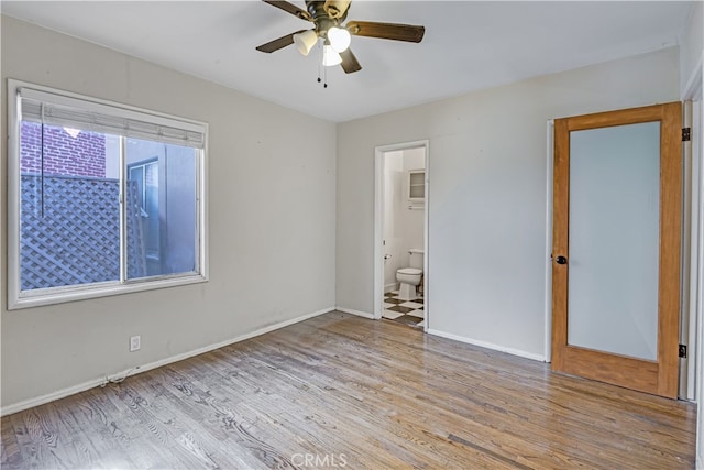 empty room featuring light hardwood / wood-style flooring and ceiling fan