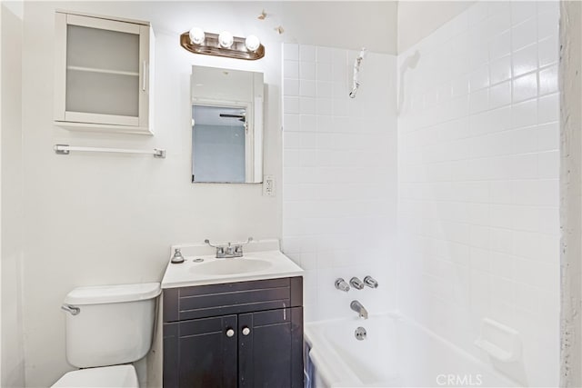 full bathroom featuring vanity, toilet, and tiled shower / bath